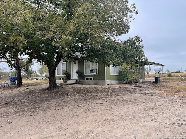 view of front of home featuring cooling unit