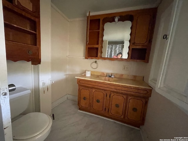 bathroom featuring vanity and toilet