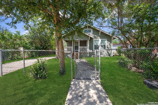 view of front of home with a front lawn and a porch