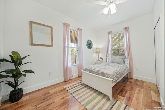 bedroom featuring light wood-type flooring and ceiling fan