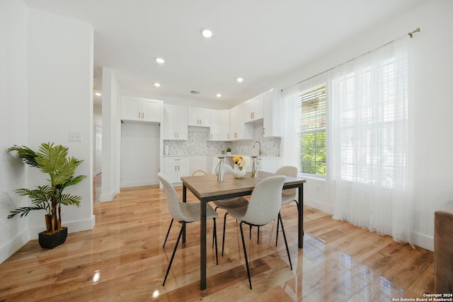 dining area with light hardwood / wood-style flooring