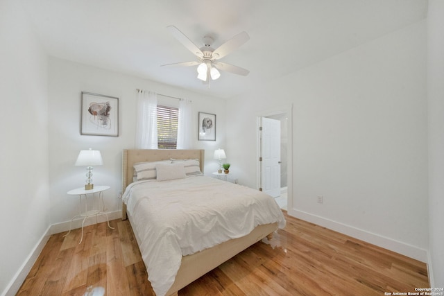 bedroom with light hardwood / wood-style floors and ceiling fan