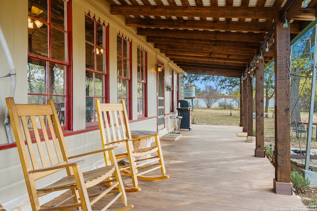 view of patio featuring a porch and area for grilling