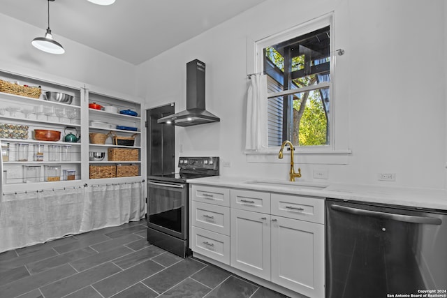 kitchen with electric range oven, wall chimney exhaust hood, sink, decorative light fixtures, and dishwasher