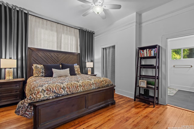 bedroom featuring light hardwood / wood-style floors and ceiling fan