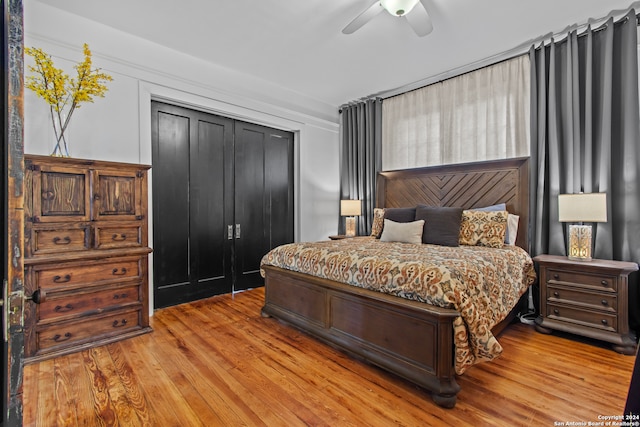 bedroom featuring ceiling fan, a closet, and light hardwood / wood-style flooring