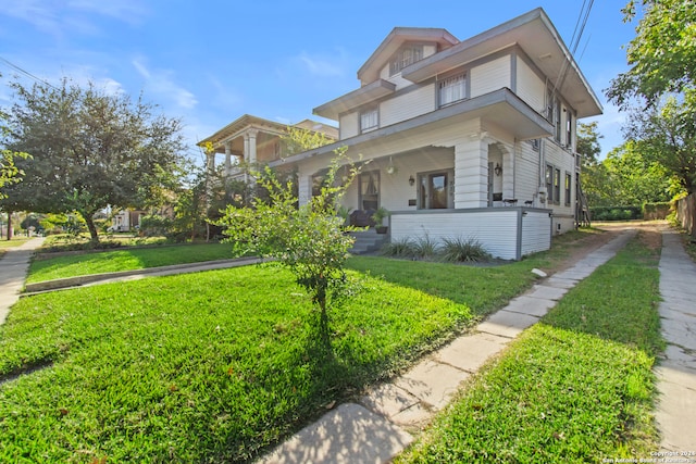 view of front of house featuring a porch and a front yard