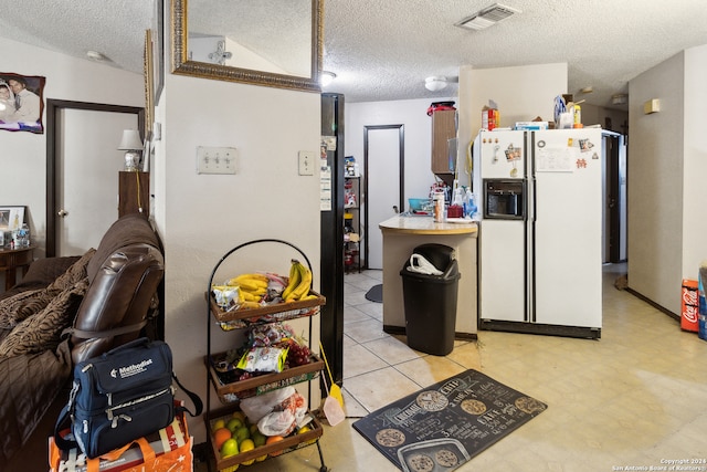 kitchen featuring white refrigerator with ice dispenser, a textured ceiling, and vaulted ceiling