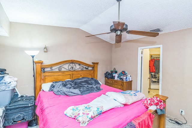 bedroom with ceiling fan and lofted ceiling