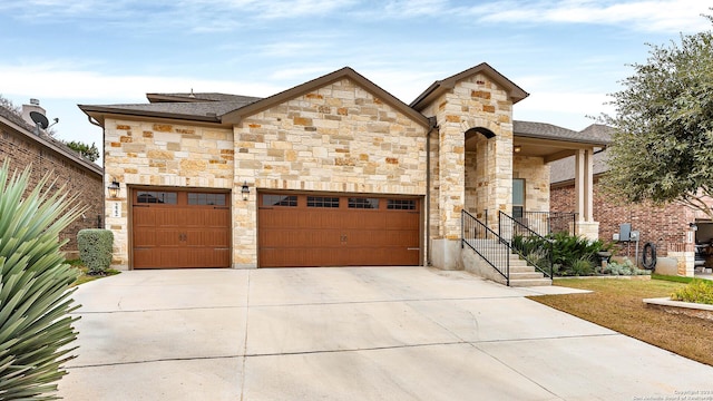 222 Sigel Ave, New Braunfels, TX 78132 - french country style house featuring concrete driveway, stone siding, a garage, and a shingled roof