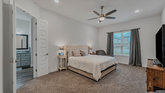 bedroom featuring carpet floors, ceiling fan, and connected bathroom