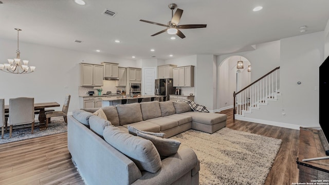 222 Sigel Ave, New Braunfels, TX 78132 - living room with a chandelier, ceiling fan, wood finished floors, recessed lighting, and stairway