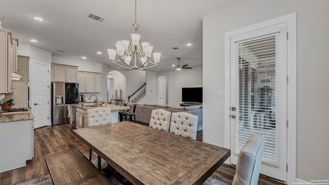222 Sigel Ave, New Braunfels, TX 78132 - dining space with arched walkways, a chandelier, recessed lighting, dark wood-style floors, and a ceiling fan