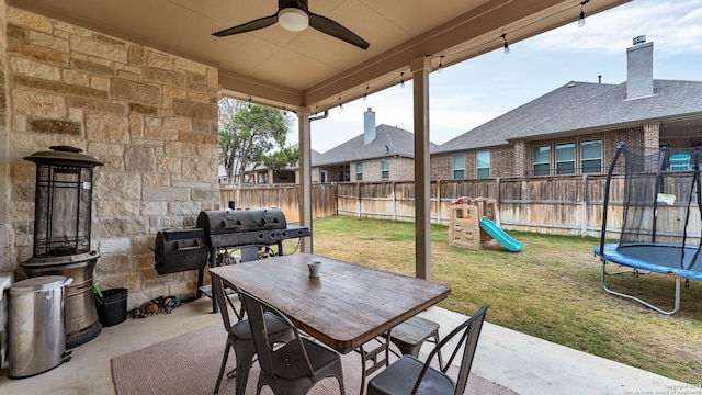 222 Sigel Ave, New Braunfels, TX 78132 - view of patio featuring a trampoline, a ceiling fan, outdoor dining area, and a grill