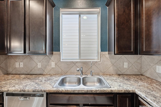 kitchen with dishwasher, decorative backsplash, dark brown cabinetry, and sink