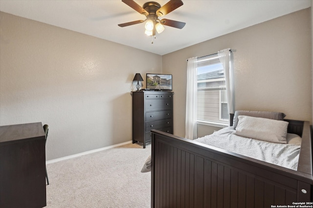 bedroom with ceiling fan and light colored carpet