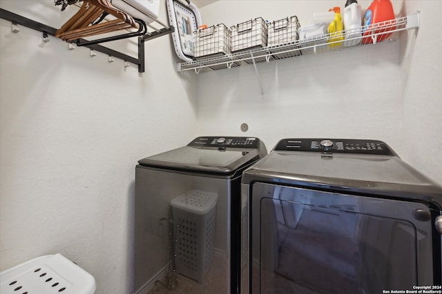 washroom with washer and dryer