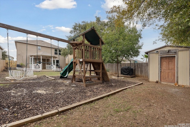 view of playground with a storage unit