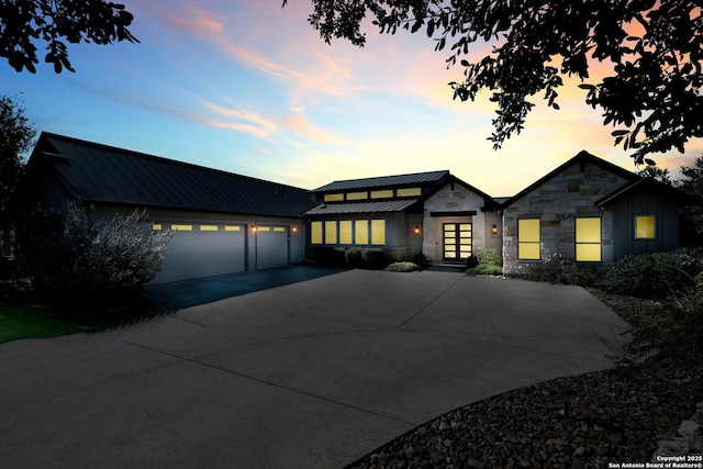 view of front facade featuring french doors and a garage