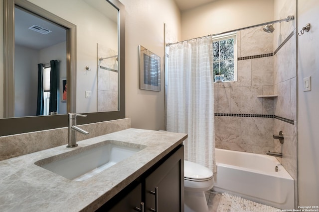 full bathroom with vanity, shower / bath combination with curtain, and toilet