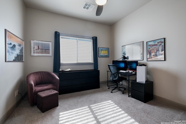 home office featuring ceiling fan and light colored carpet