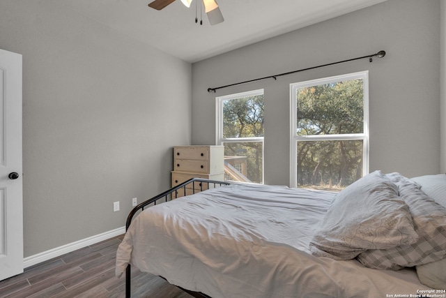 bedroom featuring dark hardwood / wood-style floors and ceiling fan