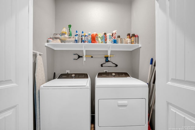 laundry room with independent washer and dryer