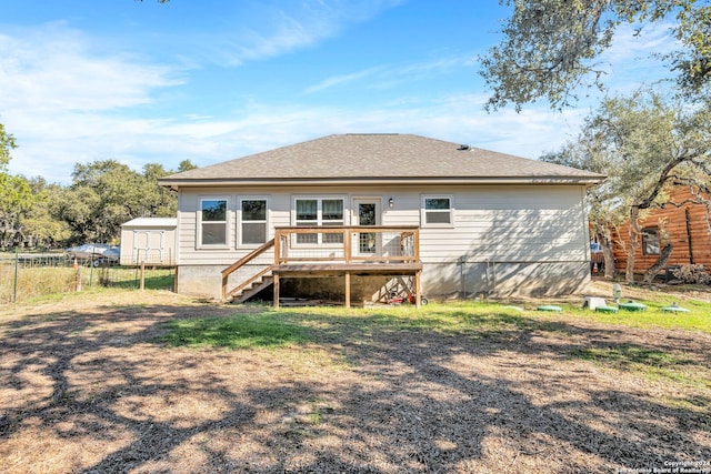 rear view of property with a wooden deck