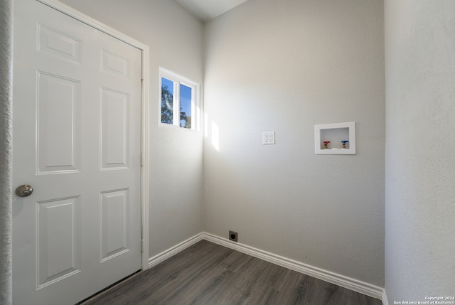 laundry area with hookup for an electric dryer, washer hookup, and dark wood-type flooring