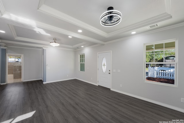 entrance foyer featuring dark hardwood / wood-style floors, crown molding, ceiling fan, and a tray ceiling