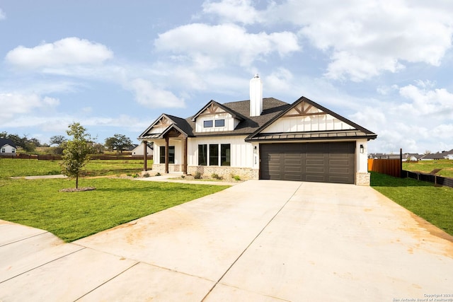 craftsman inspired home featuring a garage and a front lawn