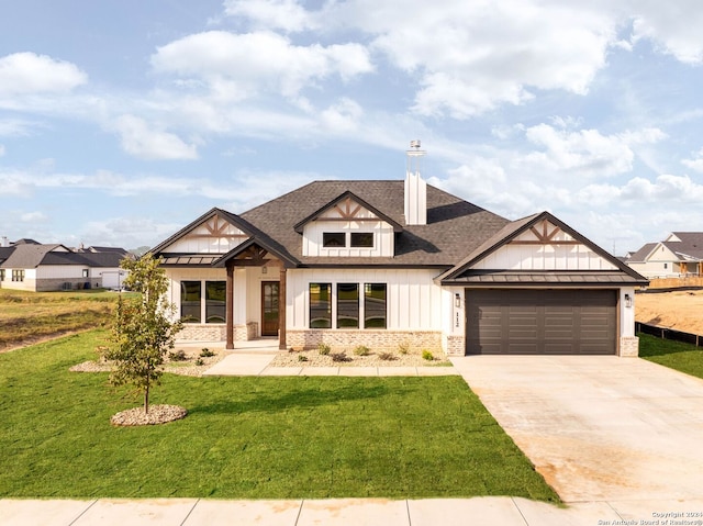 craftsman inspired home featuring a garage and a front yard