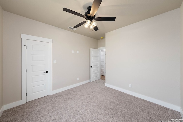 unfurnished bedroom with ceiling fan and carpet floors