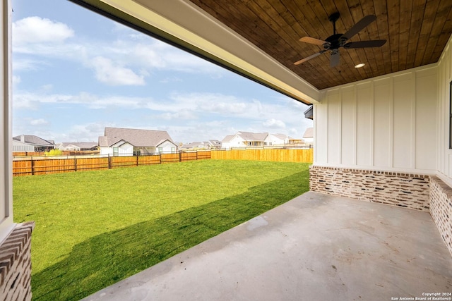 view of yard featuring a patio area and ceiling fan