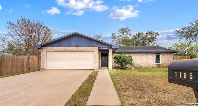 ranch-style house with a garage and a front lawn