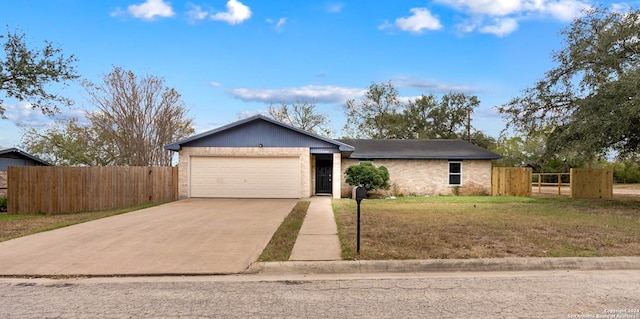 single story home with a garage and a front lawn