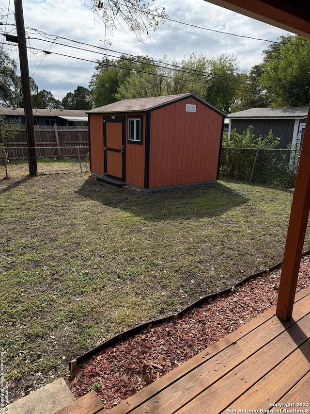 view of outbuilding with a yard