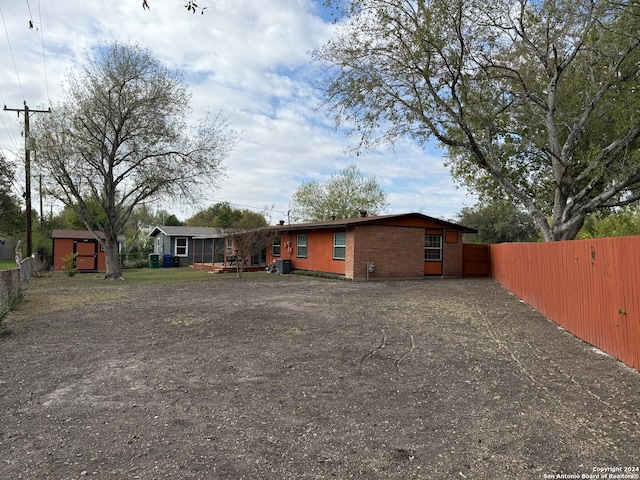 exterior space featuring a shed