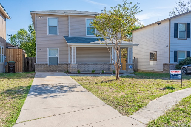 view of property featuring a front yard