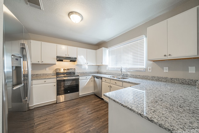 kitchen featuring sink, white cabinetry, stainless steel appliances, and dark wood-type flooring