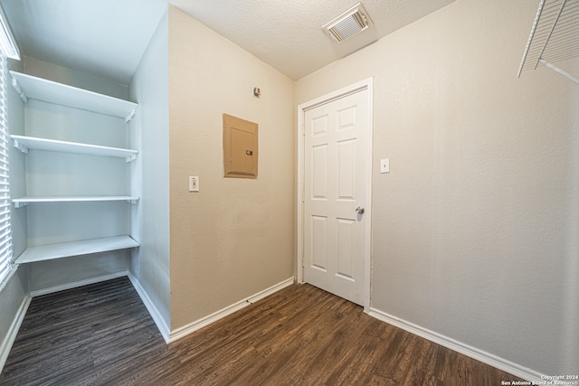 hallway with electric panel and dark hardwood / wood-style floors