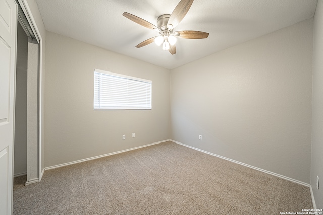 unfurnished bedroom with carpet and ceiling fan