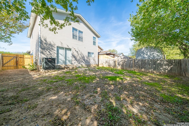 back of property with central AC unit