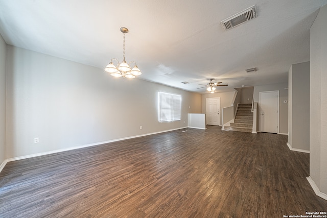 unfurnished living room with dark wood-type flooring and ceiling fan with notable chandelier