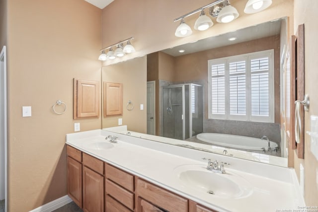 bathroom featuring vanity and shower with separate bathtub