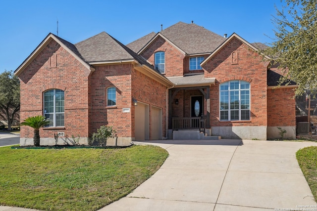 view of front facade with a garage and a front yard