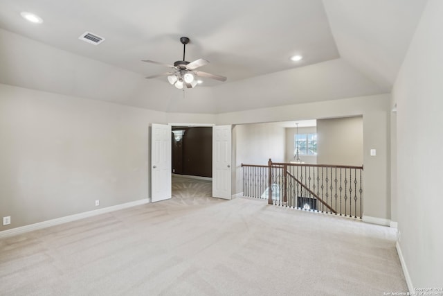 unfurnished room featuring light carpet and ceiling fan