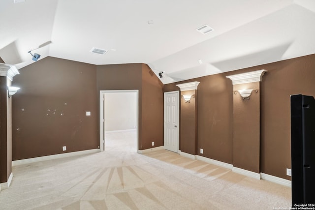 cinema room with light colored carpet and lofted ceiling