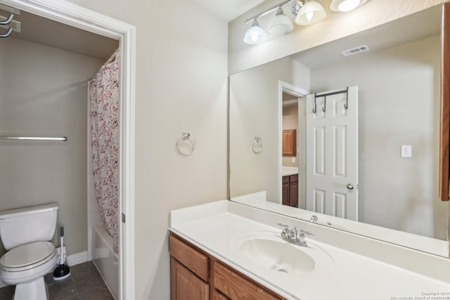 full bathroom with tile patterned flooring, shower / bath combo, vanity, and toilet