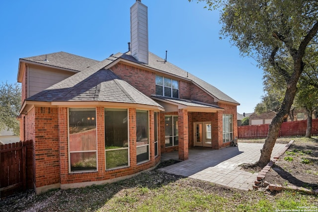 rear view of property featuring a patio area